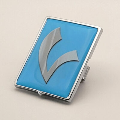 Vespa-Piaggio Emblem – Light Blue with Silver "V"